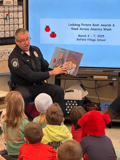Chief Holland reading to EVS students